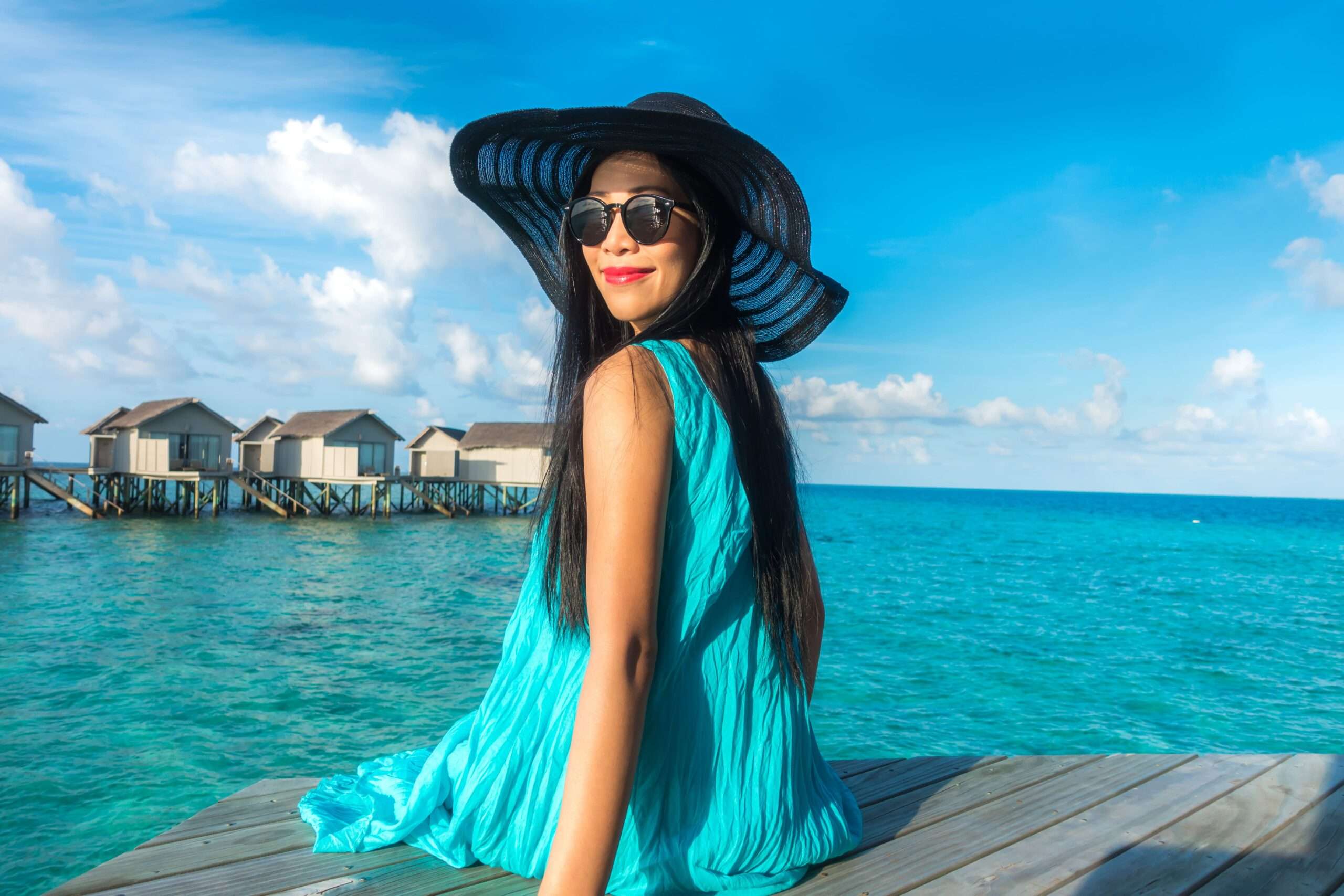 portrait-happy-young-woman-beautiful-water-villa-maldives-island-travel-vacation-outdoor-shot (1)
